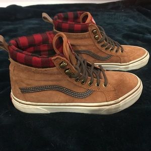 Vans off the Wall woman’s high top shoes.